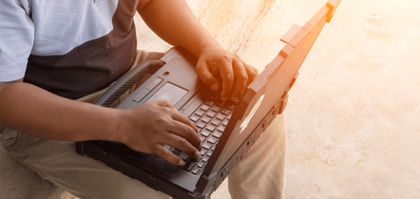 A man using a laptop.