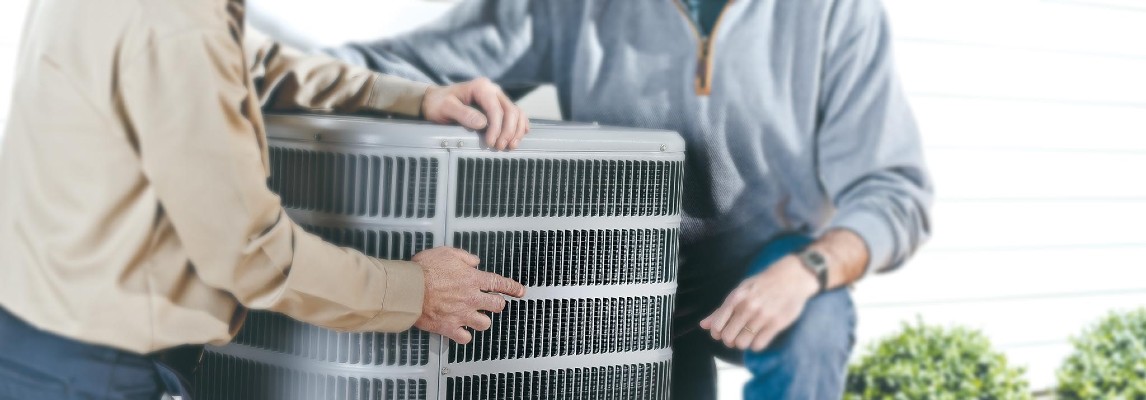 ENERGY STAR certified condensing unit with HVAC techs nearby